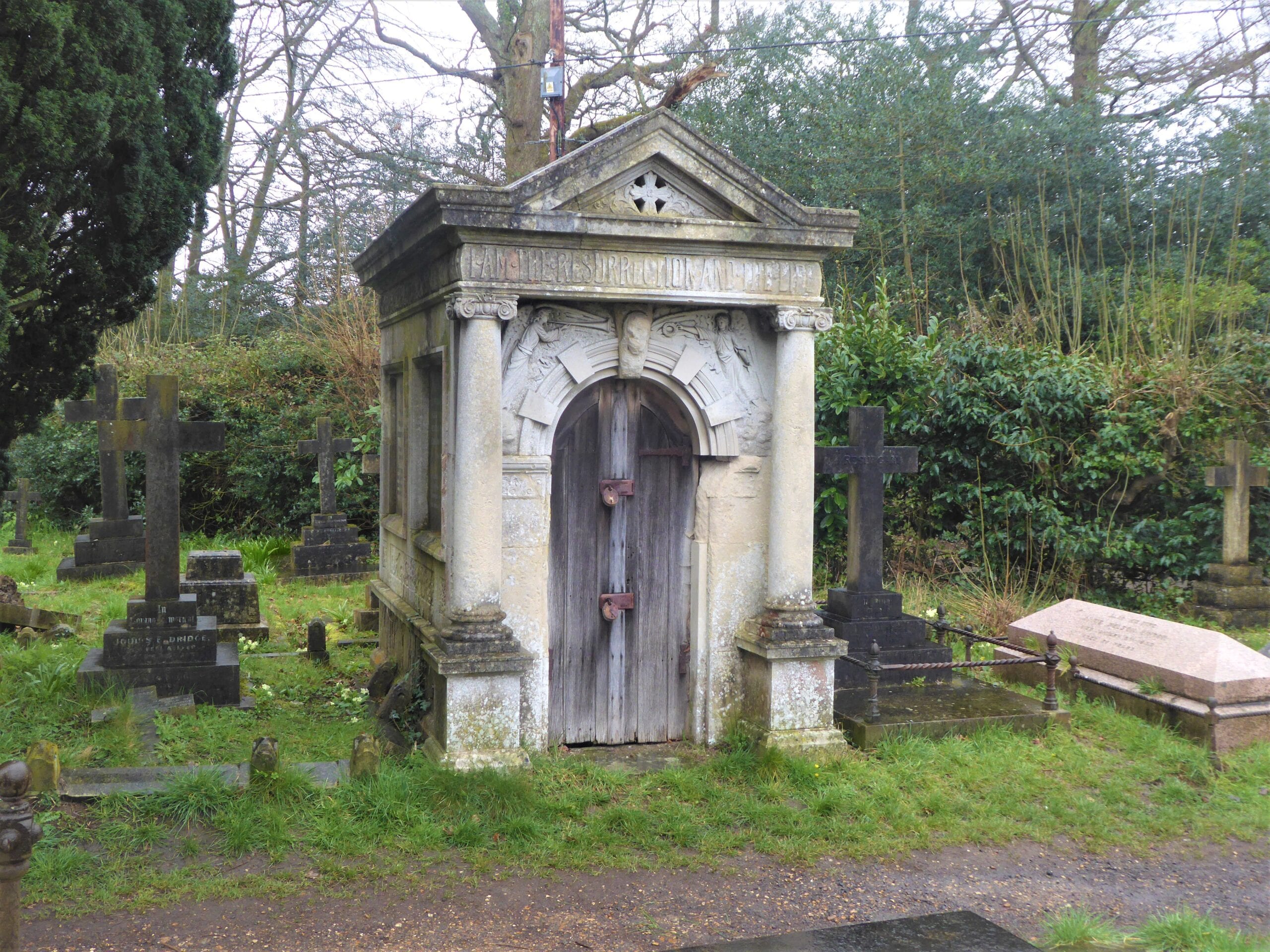 A photo of a mausoleum in the cemetery that was damaged during world war 2.
